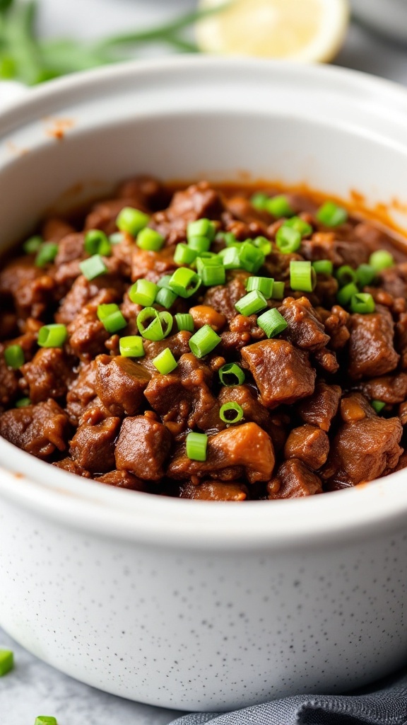 A bowl of delicious crockpot Mongolian beef garnished with green onions.