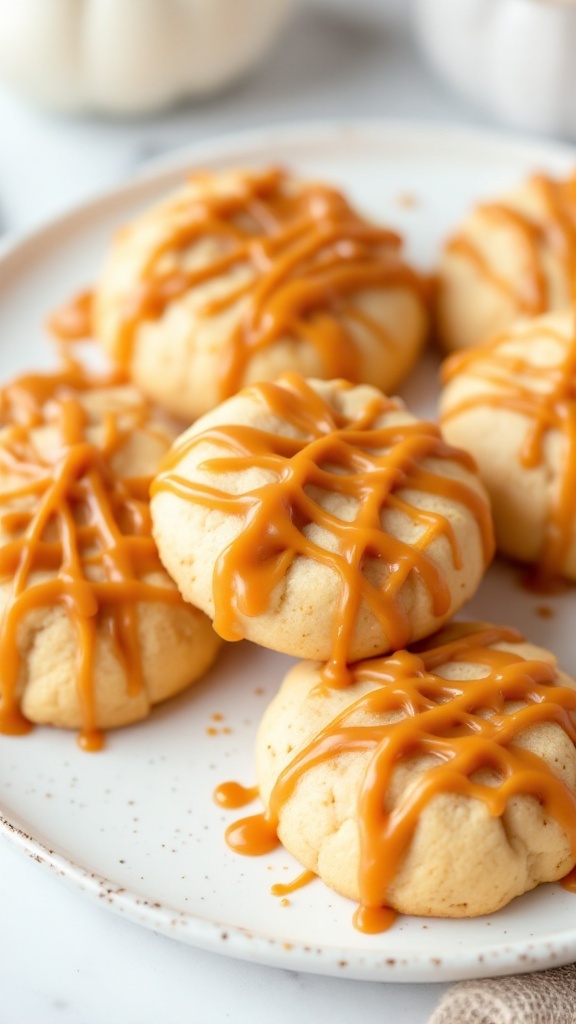 Delicious caramel apple butter cookies drizzled with caramel sauce on a plate.