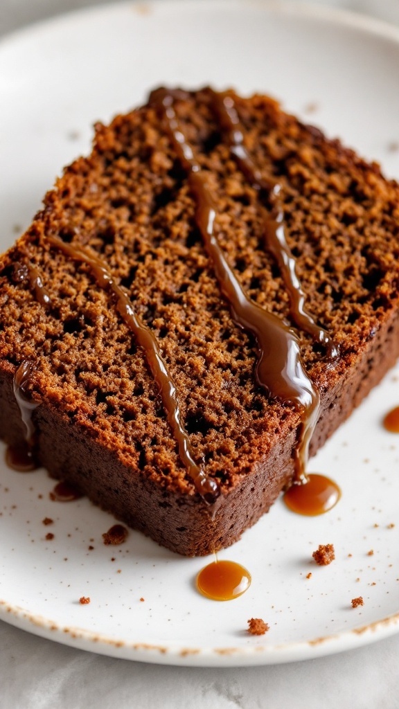 Sliced gingerbread loaf with molasses drizzled with caramel sauce