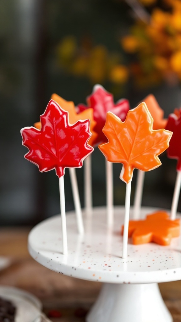 Maple leaf shaped cake pops in various autumn colors.