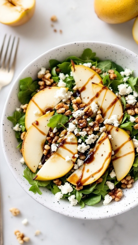 A bowl of Pear and Gorgonzola Salad with walnuts and greens